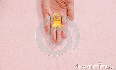 Cancer awareness hand ribbon top view, vintage picture style donate healthcare concept Stock Photo