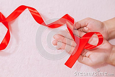 Cancer awareness hand ribbon top view, vintage picture style donate healthcare concept Stock Photo