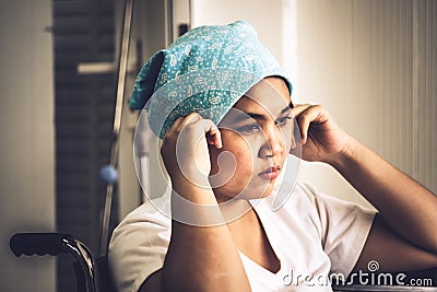 Cancer patients women sitting on a wheelchair Stock Photo