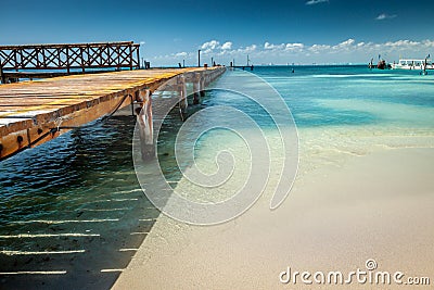 Cancun idyllic caribbean beach and wooden pier, Riviera Maya, Mexico Stock Photo