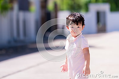 Candid cute little boy sweating on face. Happy healthy sweaty face child. Baby aged 1-2 years old. Stock Photo