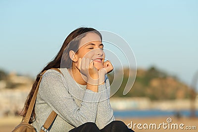 Candid happy girl resting enjoying a sunny day Stock Photo