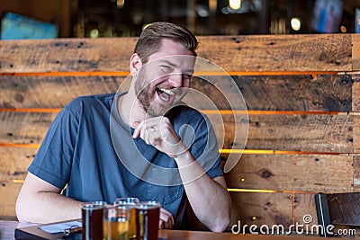 Candid portrait of a young man laughing Stock Photo