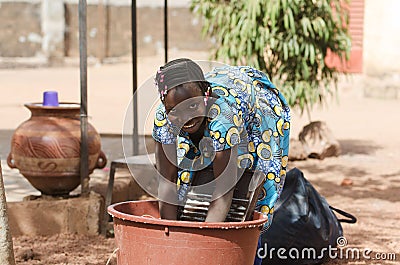 Candid Shot of African Black Ethnicity Girl Child Labour Stock Photo