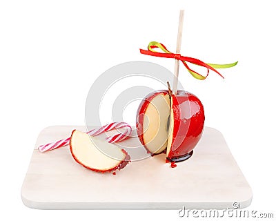 Candied apple with a candy cane Stock Photo