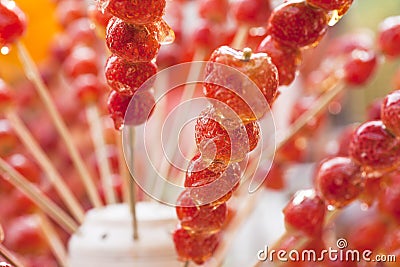 Candied haws on stick Stock Photo