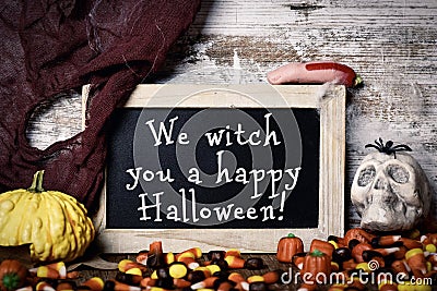 Candies and text We witch you a happy Halloween Stock Photo