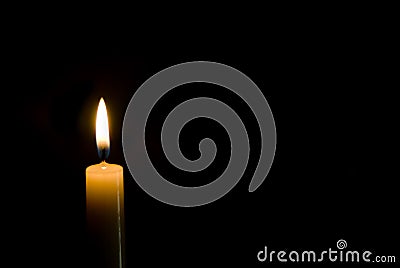 Candle on black Stock Photo