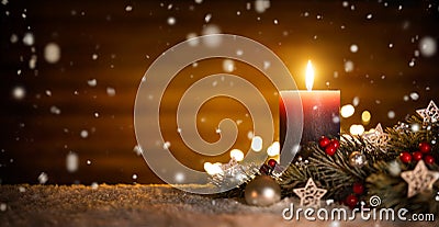 Candle and Christmas decoration with wooden background and snow Stock Photo
