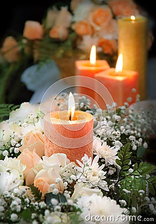 Candle on floral background Stock Photo