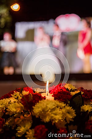 A candle in the flower - blurred wedding celeblation background Stock Photo