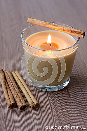 Candle in the Glass and Cinnamon Stock Photo