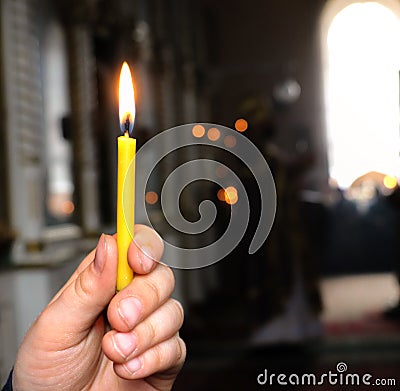 A candle in the hand of a child Stock Photo