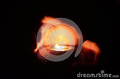 Candle in the hands Stock Photo