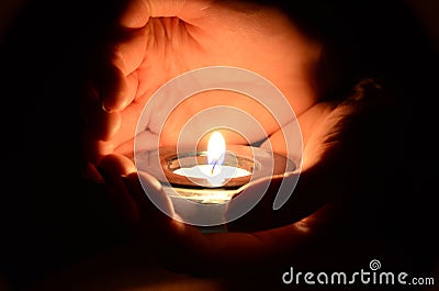 Candle in the hands Stock Photo