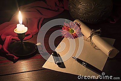 Candle illuminates the Desk where the letter Stock Photo