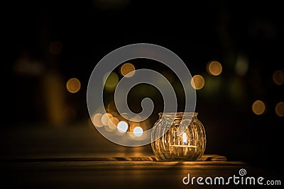 Candle light in glass small jar Stock Photo