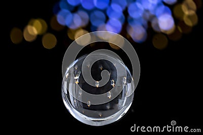 Candle lighted in Magic crystal ball of divination. Interpretation of dreams, Psychic, fortune telling ion black with Stock Photo