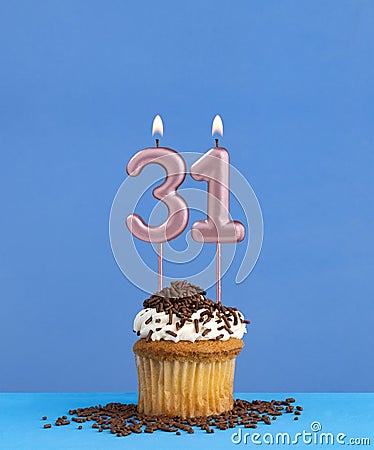 Candle number 31 - Birthday card with cupcake on blue background Stock Photo