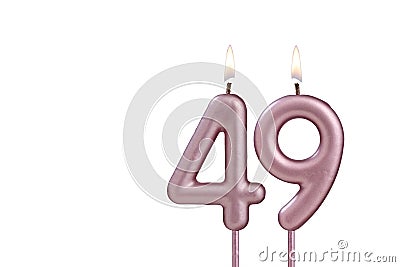 Lit birthday candle - Candle number 49 on white background Stock Photo