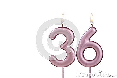 Candle number 36 - Lit birthday candle on white background Stock Photo
