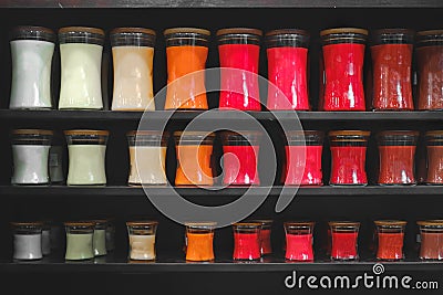 Candle store scented candles shelves black background shelf matt Stock Photo