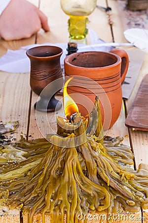 Candle traditional melted wax big stein vertical photo middle ages Stock Photo