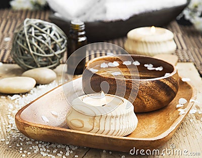Candle and Water Bowl Spa Setting.Wellness Day-Spa Stock Photo