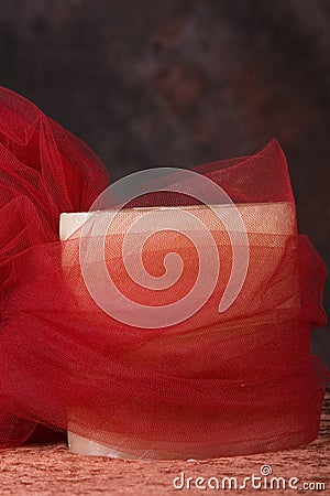 Candle wrapped in red net Stock Photo