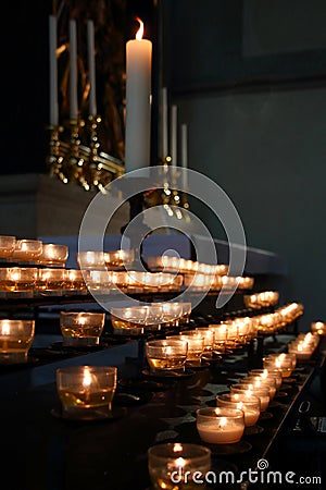 Candlelights, tealights, church light inside an church Stock Photo