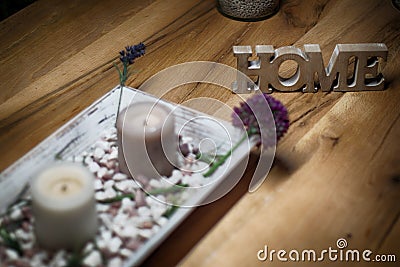 Candles with home sign on wooden table- rest and relaxation Stock Photo