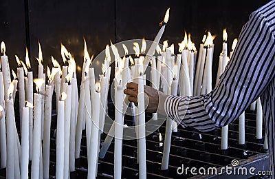 Candles lit lourdes Stock Photo