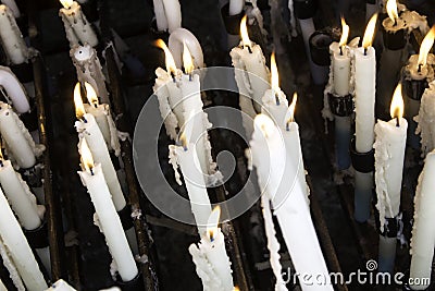 Candles lit lourdes Stock Photo