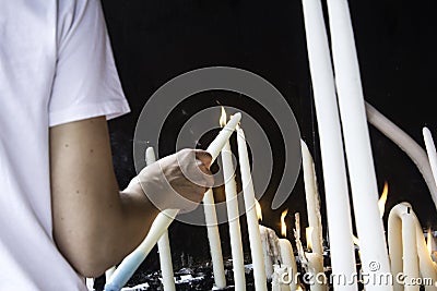 Candles lit lourdes Stock Photo