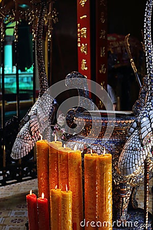 Candles lit on alter, Pagoda Chua Min Huong, Ho Chi Minh City Stock Photo