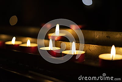 Candles lit red during a session of spiritualism. Concept of occultism Stock Photo