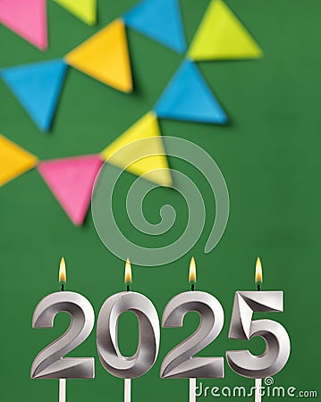 Happy New Year 2025 - Candles in the form of lit numbers Stock Photo