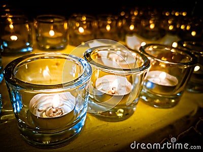 Candles in small little glasses during the vigil ceremony and prayer Stock Photo