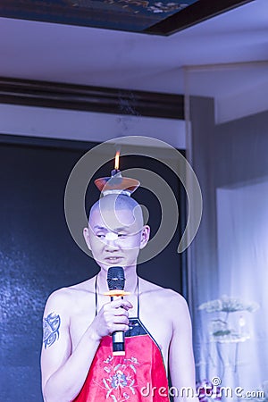 Candles on their heads - Sichuan opera performance Editorial Stock Photo