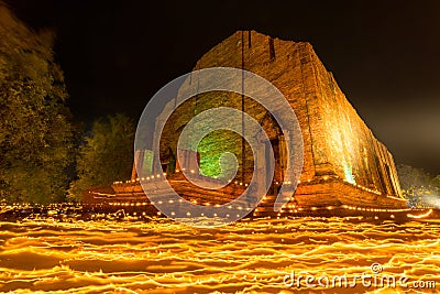 Candles waving rite on Buddhist holy day Stock Photo