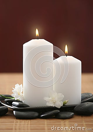 Candles and white lilac flower Stock Photo