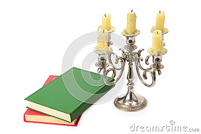 Candlestick and books isolated on white background Stock Photo