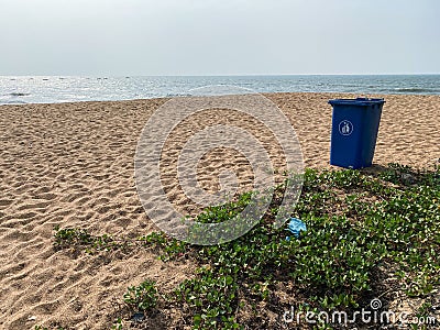 A garbage bin on a pristine beach in the village of Sinquerim in Goa Editorial Stock Photo