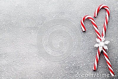 Candy cane. Christmas decors with gray background. Stock Photo