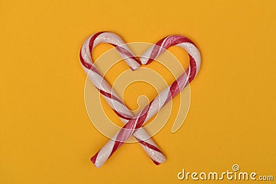 Candy canes shaped like a heart crossed at the bottom Stock Photo