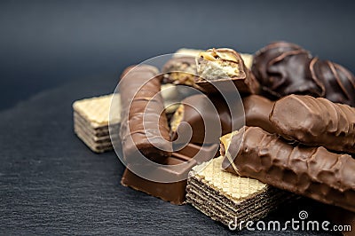 Candy chocolate wafers Brown sweet on black background Stock Photo