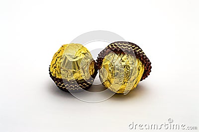 Candy Ferrero Rocher close-up isolate sweet gold Stock Photo