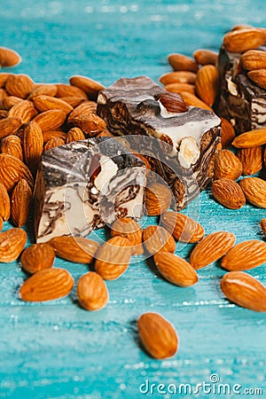 Candy paste and almonds on blue wooden background Stock Photo