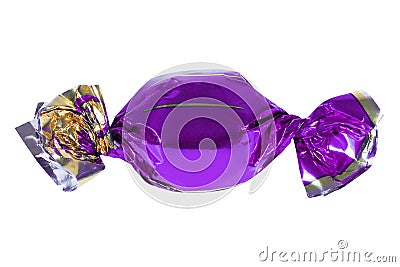 Candy in purple foil isolated. Candy wrapped in a label. Christmas Stock Photo