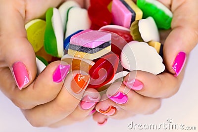 Candys in hands Stock Photo